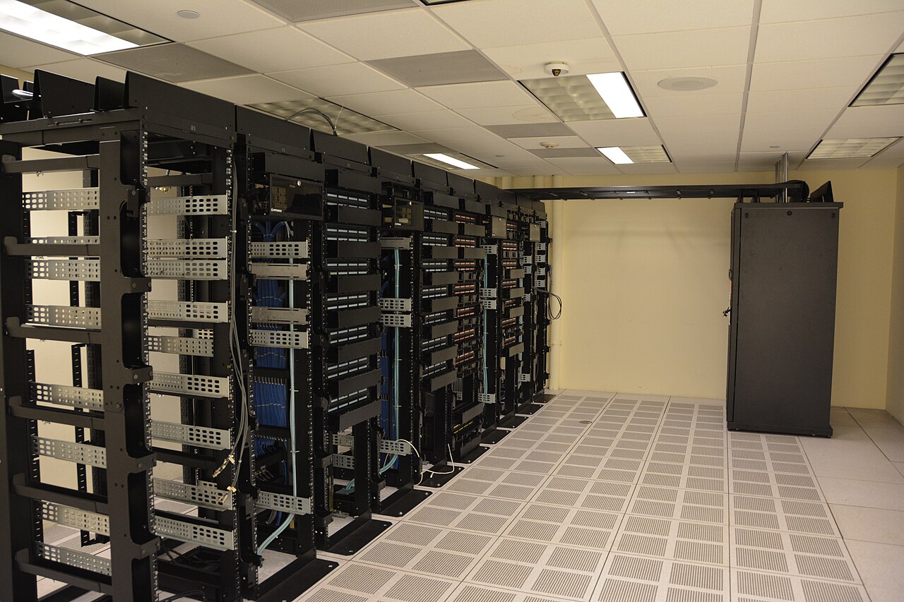Server racks inside a data center; contextual file photograph.